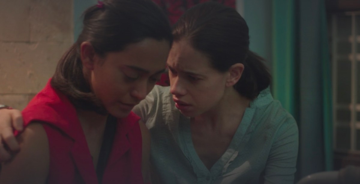 A screenshot of "Margarita With a Straw" in which one woman holds another woman by the shoulders to comfort her while she cries.