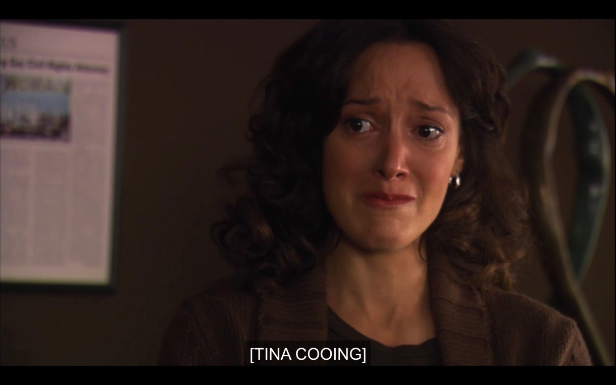 Bette crying in Joyce's office. Caption reads: [Tina Cooing]