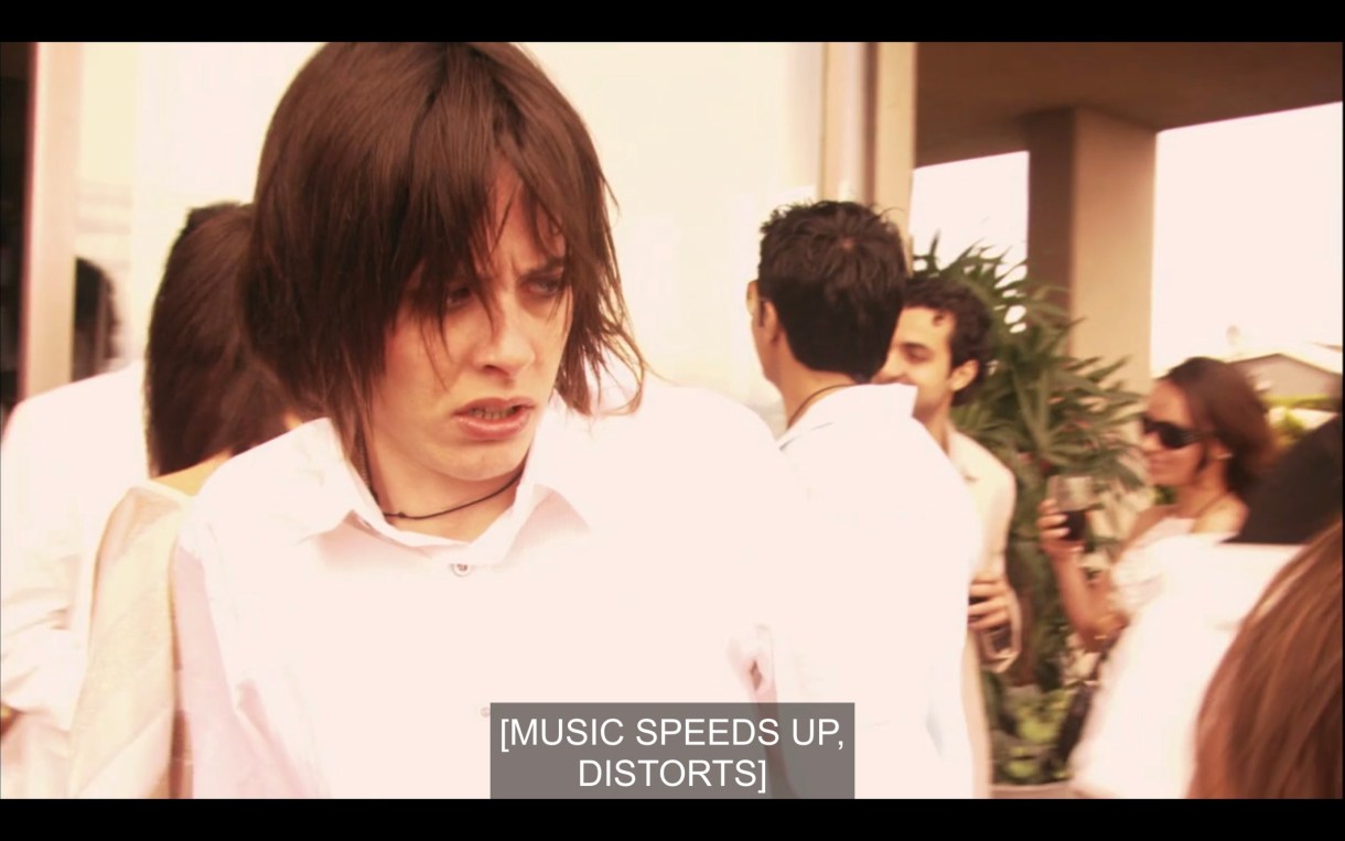 A confused Shane works her way through the party. Subtitles read, "[Music speeds up, distorts.]"
