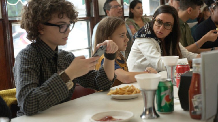 Sam her kids at a diner