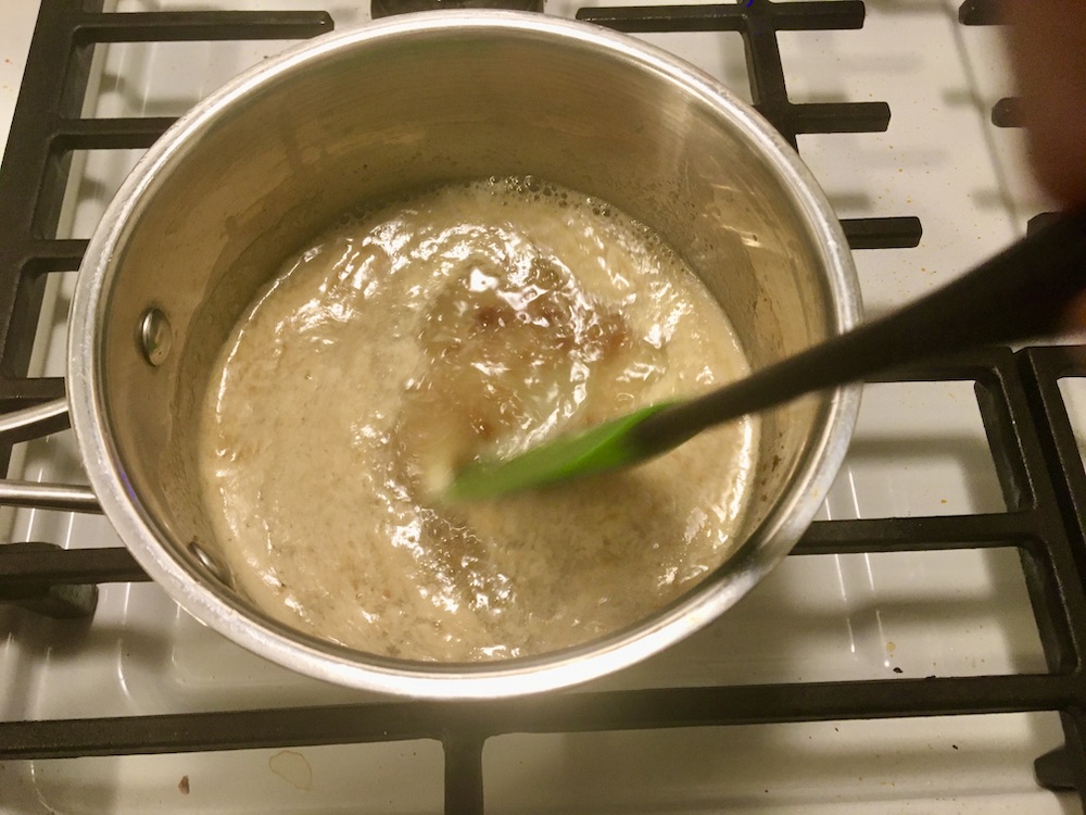 butter browning in a sauce pan, spatula stirring