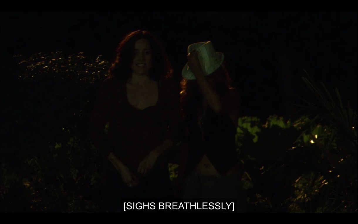 Dark shot of Helena and Papi outside at night, they have just hooked up. Subtitles read, "[sighs breathlessly.]"