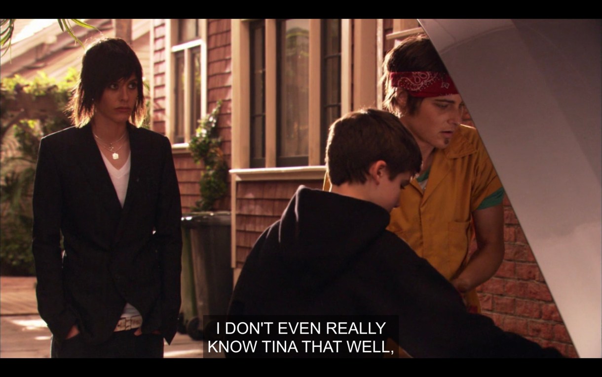 Max and Shay are looking into the hood of a car. Shane is standing behind them. Max says, "I don't even really know Tina that well."