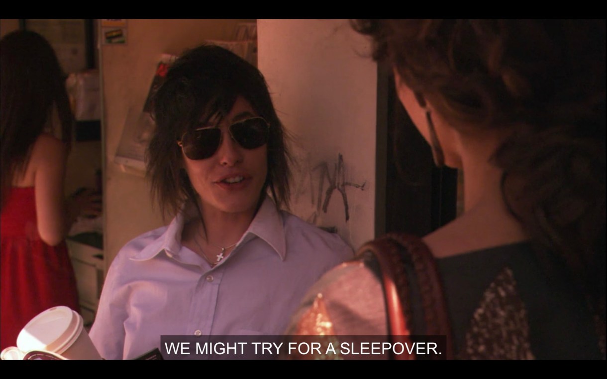 Shane in a blue button up and aviator sunglasses. "We might try for a sleepover."