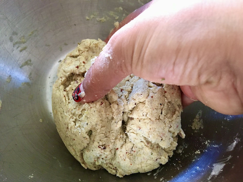 hand mixing up dough