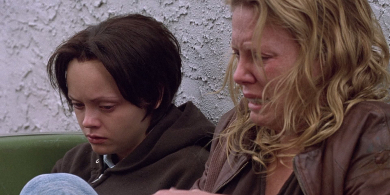 Charlize Theron and Christina Ricci sit next to each other and cry.
