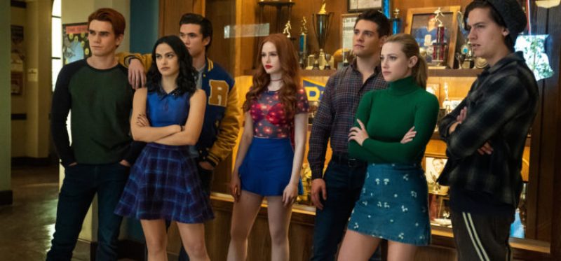 Riverdale -- "Chapter Seventy-Six: Killing Mr. Honey" -- Image Number: RVD419a_0093b -- Pictured (L - R): KJ Apa as Archie Andrews, Camila Mendes as Veronica Lodge, Charles Melton as Reggie Mantle, Madelaine Petsch as Cheryl Blossom, Casey Cott as Kevin Keller, Lili Reinhart as Betty Cooper and Cole Sprouse as Jughead Jones -- Photo: Katie Yu/The CW -- © 2020 The CW Network, LLC. All Rights Reserved.