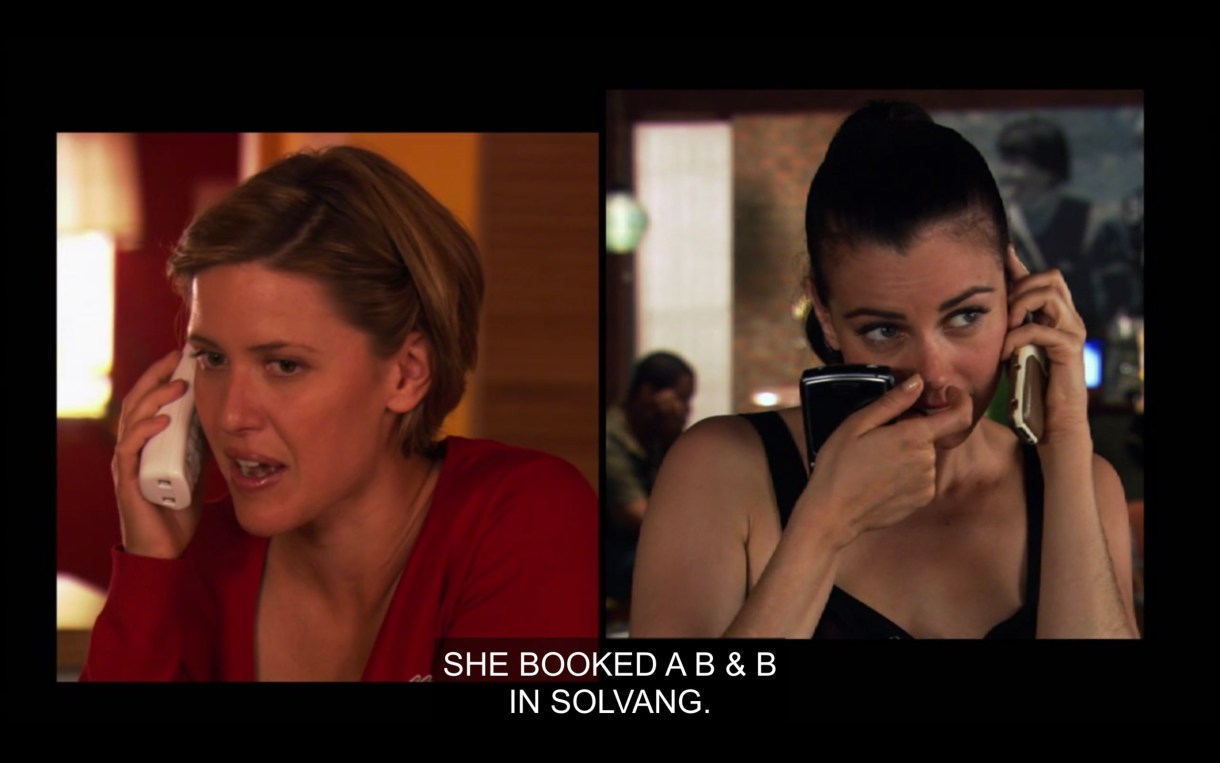A side-by-side visual of Lindsey (Jenny's dog's vet, wearing a red shirt) and Jenny (wearing a black tank top and scratching her nose) talking on the phone. Lindsey says, "She booked a B&B in Solvang."