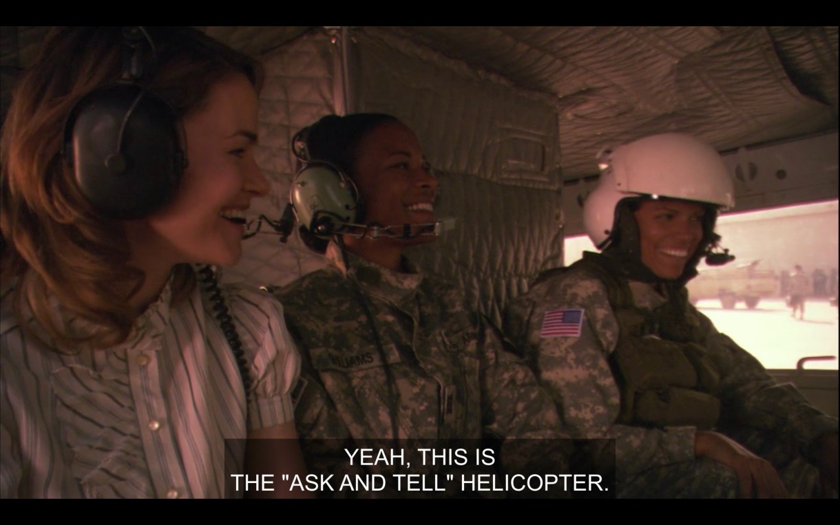 Inside a helicopter: Alice, another soldier and Tasha. Everyone is laughing and happy. Caption reads 'Yeah this is the "ask and tell" helicopter."