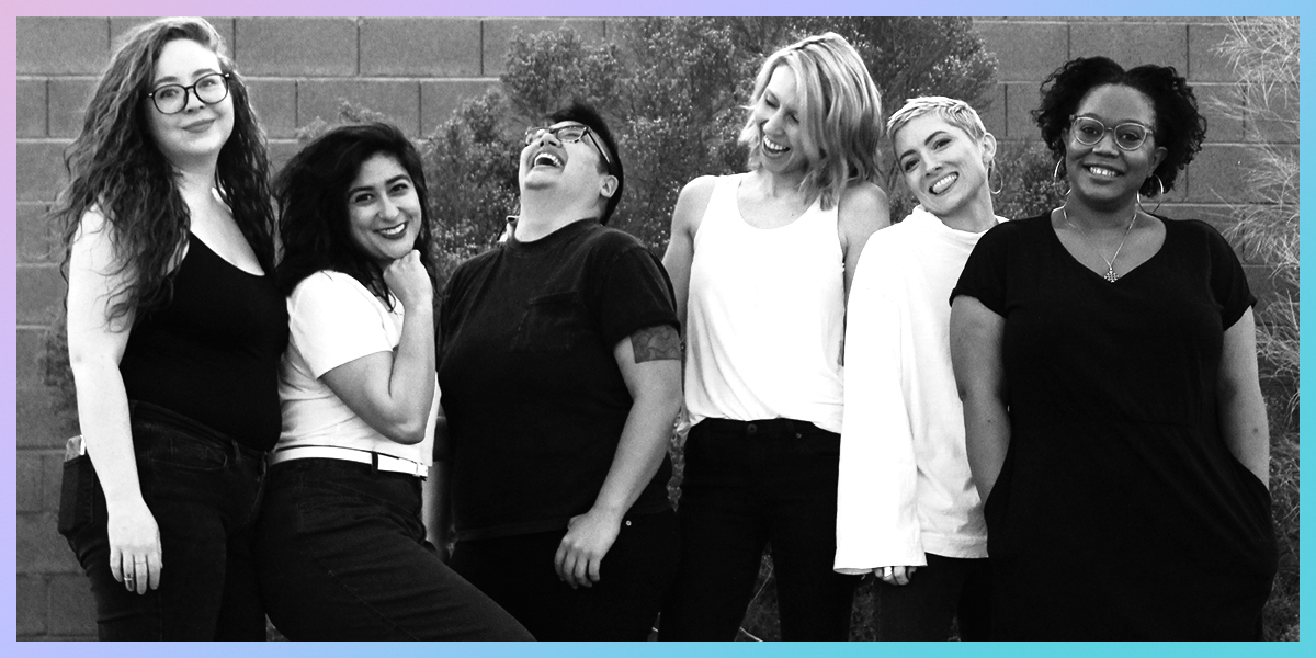 the AS senior team laughs together in a line. photo is black and white yet cheerful.