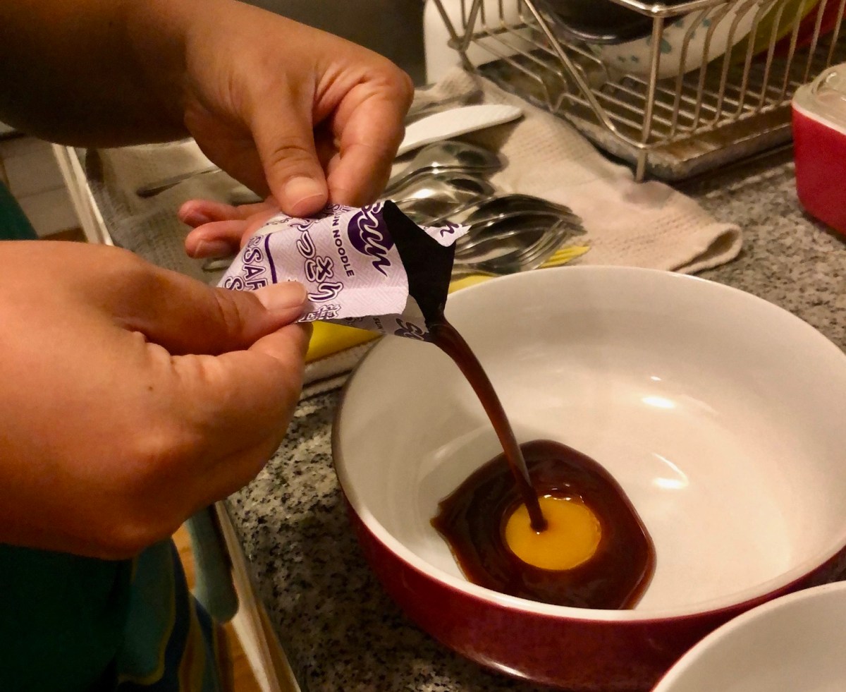 pouring sauce packet into bowl