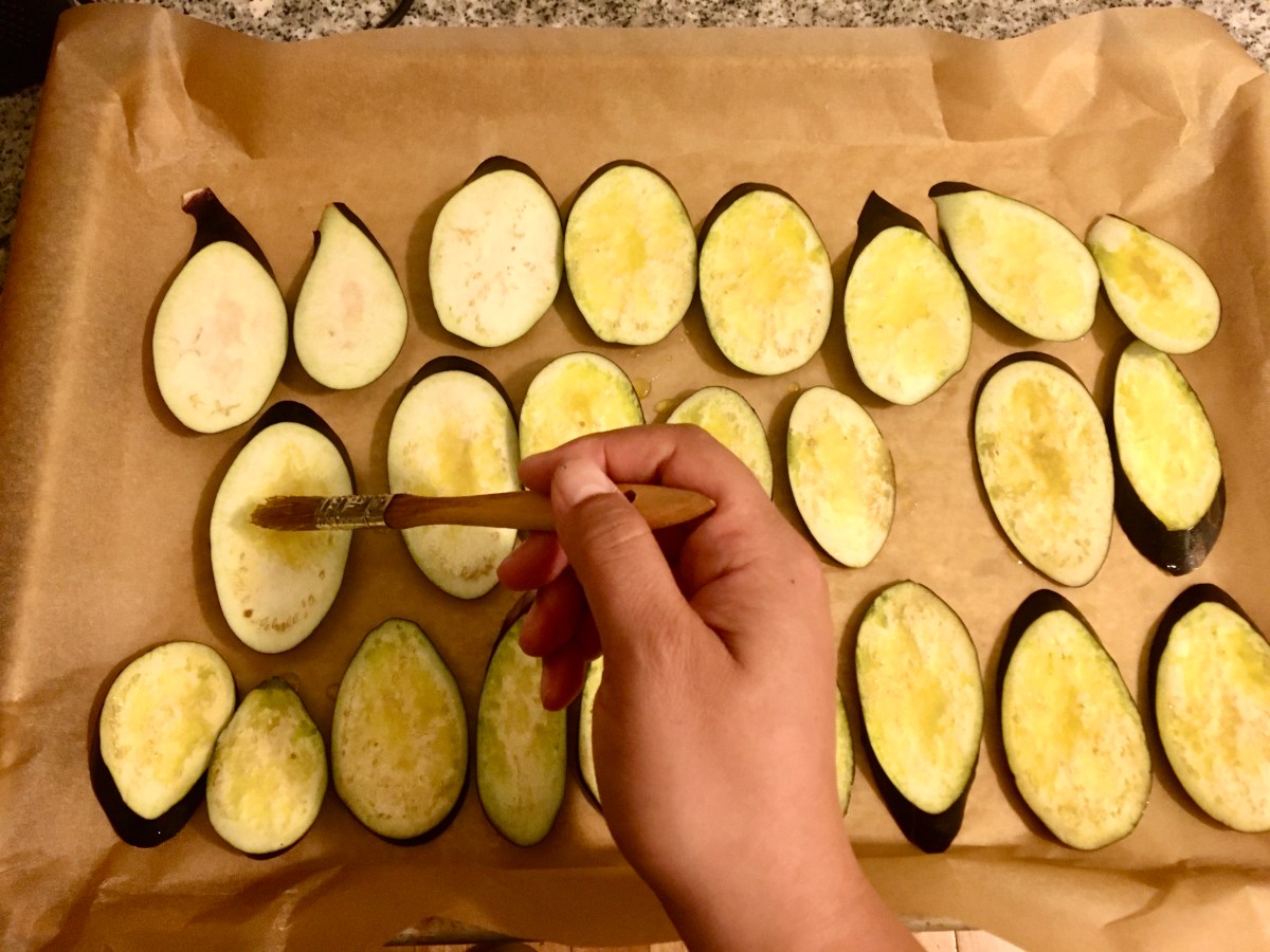 round slices of eggplant on a sheet pan 