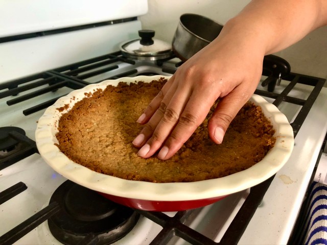 golden hand on a baked golden cookie crust