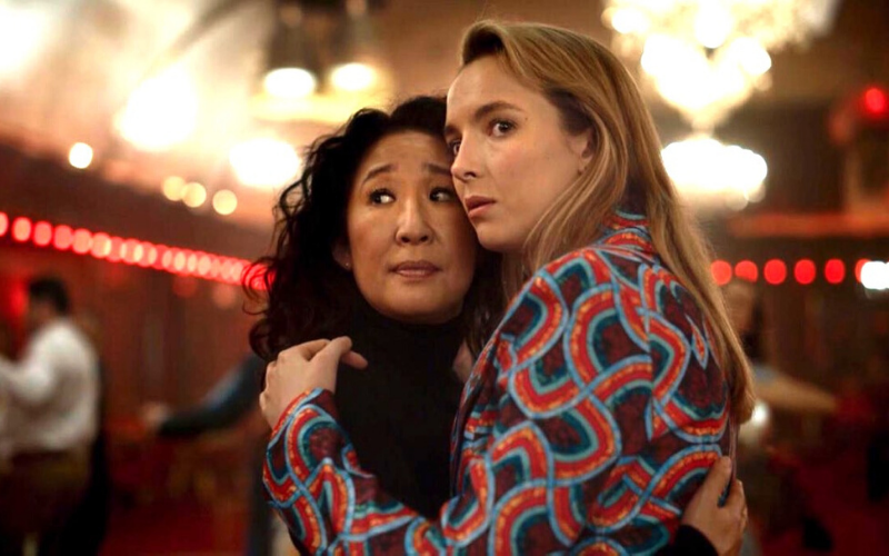 Actress Jodie Comer holds actress Sandra Oh