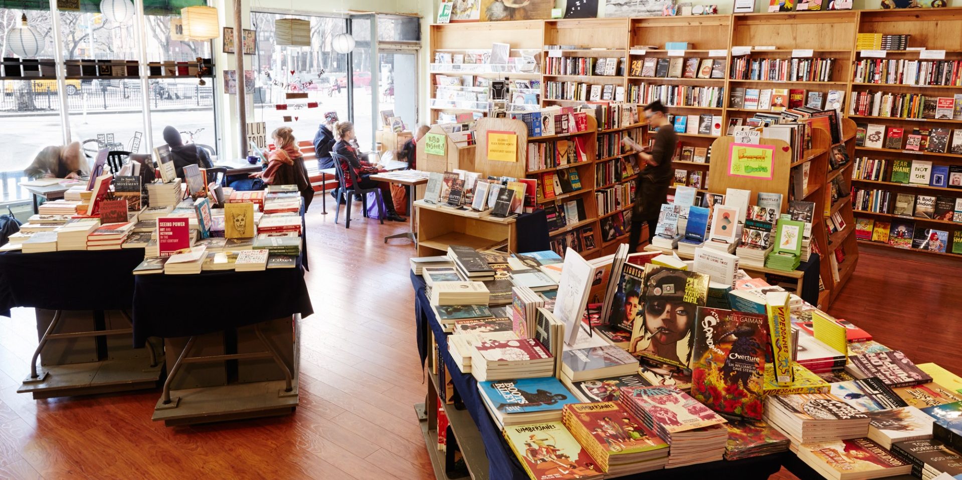 A wide angle photo of the inside of Bluestockings bookstore and activist center.