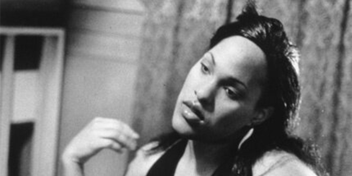 Black and white photo of model in her room in Queens, NY. Image by Mariette Pathy Allen.