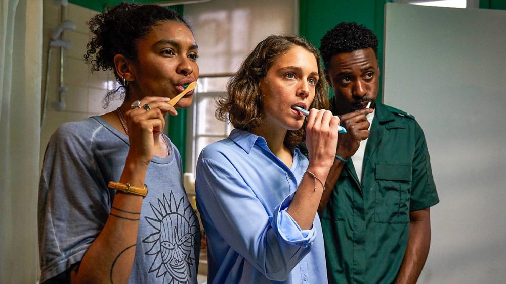 HBO Max lesbian streaming guide: Gemma, Ray and Kieran brush their teeth in a shared bathroom in the HBO triad-centric romantic comedy "Trigonometry"