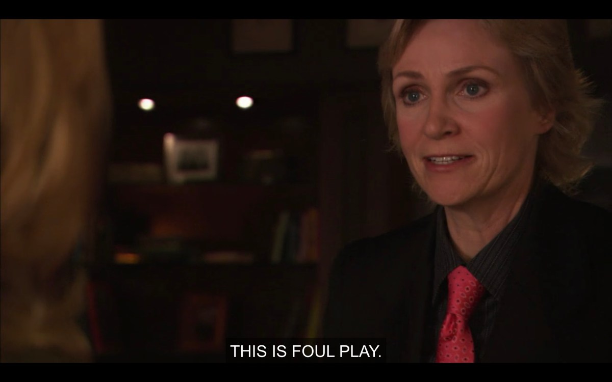 Joyce in a pink tie in Phyllis's office says "this is foul play."