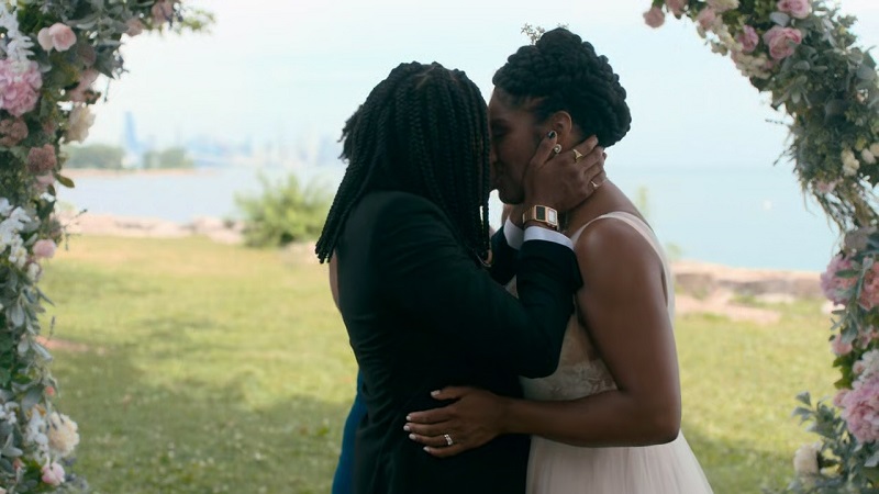 Nina and Dre cement their wedding vows with a kiss.