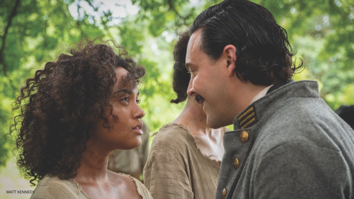 Kiersey Clemons as Julia in "Antebellum." Julia stares down a white Confederate solider with defiance in her eyes.