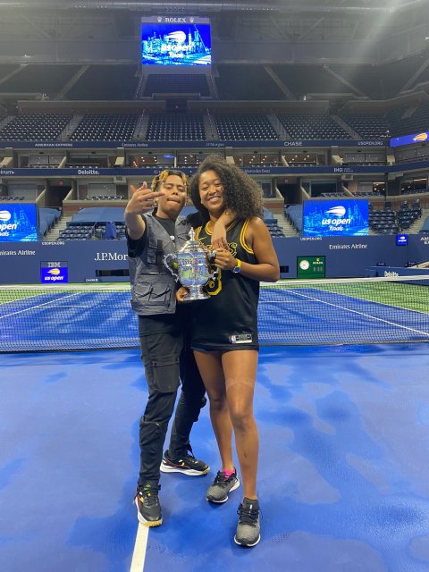 Naomi Osaka and her boyfriend, the rapper Cordae, celebrate her Tennis win at the US Open by posing together and acting silly for the camera.
