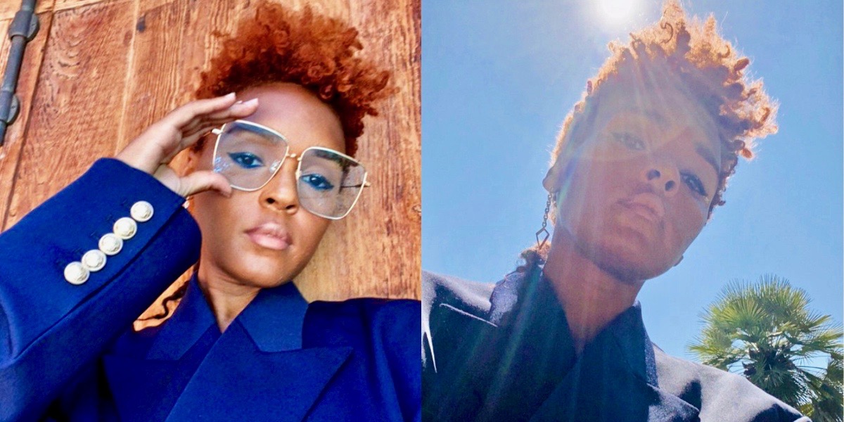 Janelle Monae looks handsome in new closely cropped red hair and big glasses. She's also wearing a blue suit in the sunshine.
