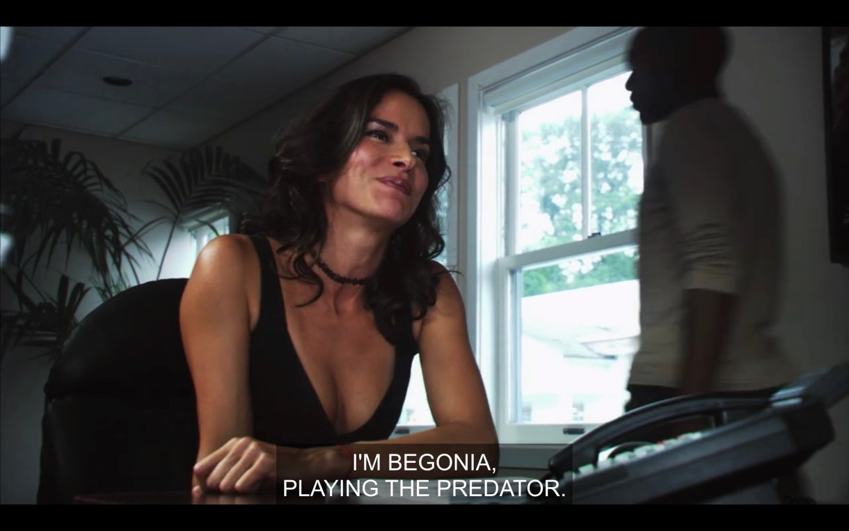 Actress at a table reading for Lez Girls saying "I'm Begonia, playing the predator."