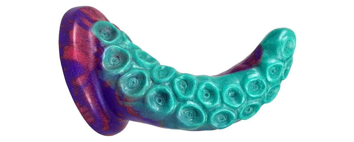 a purple/pink/turquoise dildo with a sharp curve and a lot of tentacle-like suckers all over the surface