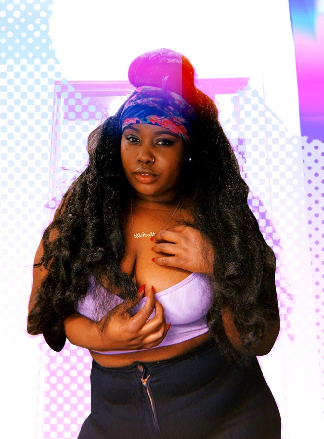 A photo from the hips up of Shelli, a Black woman with long waist-length hair and long red nails; she's wearing a scarf as a headband, cropped tank top, nameplate necklace and tight black jeans.