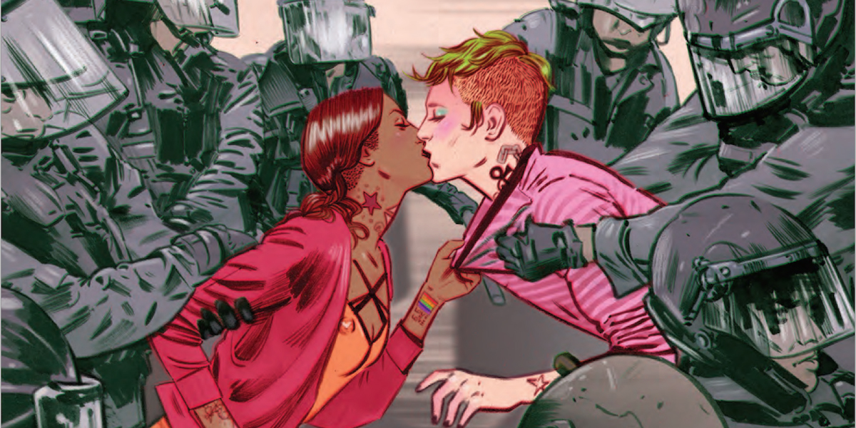 Two brightly colored figures, one brown with brown hair and one white with red hair, clutch each other and kiss as they seem to be pulled in opposite directions by an imposing crowd of riot police drawn in grays and browns