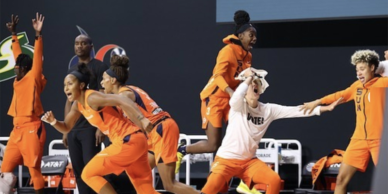 The Connecticut Sun celebrate their victory over the Las Vegas Aces in the WNBA semifinals.