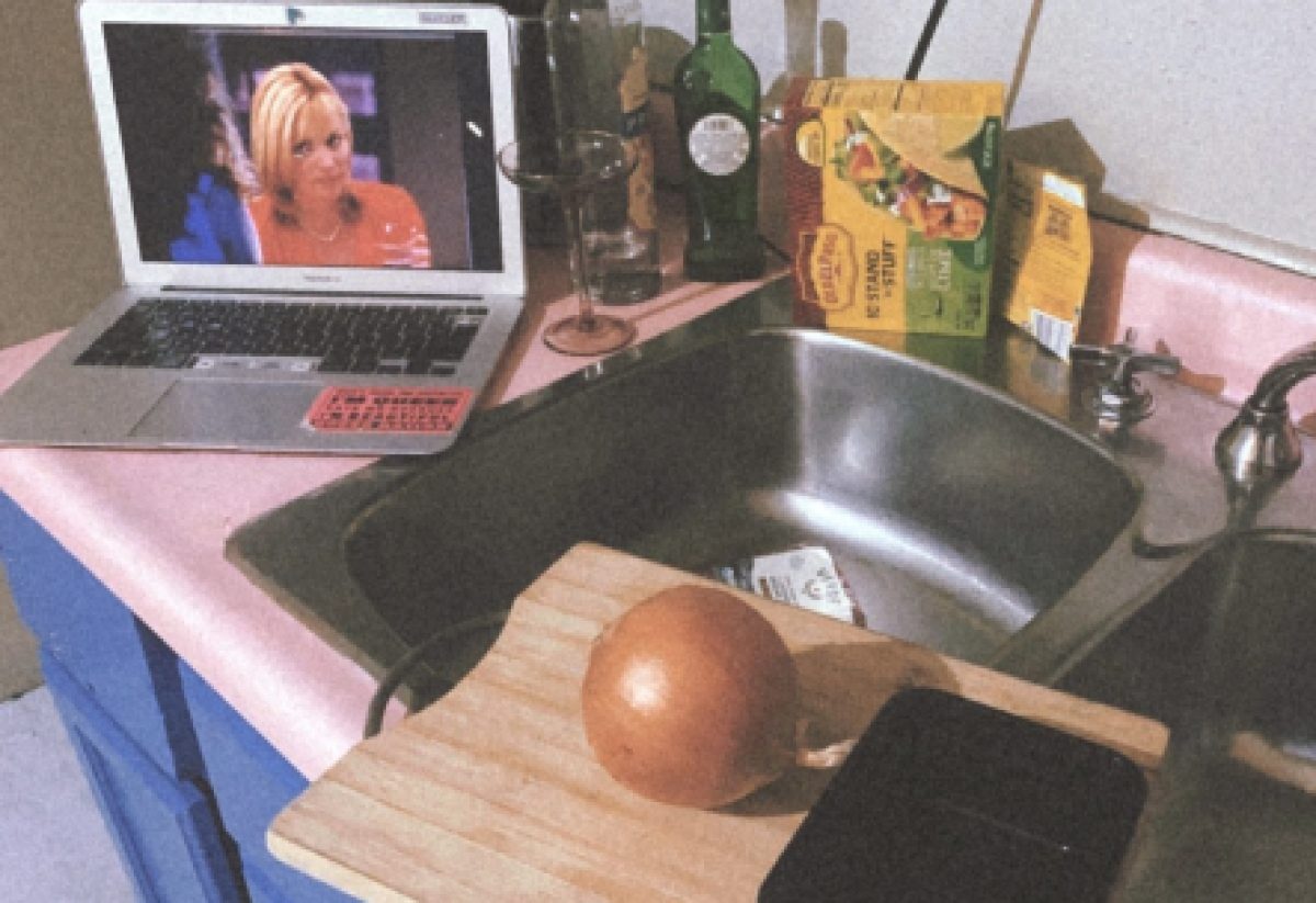 "Sex and the City" plays on Shell's laptop in her kitchen, which has a pink countertop.