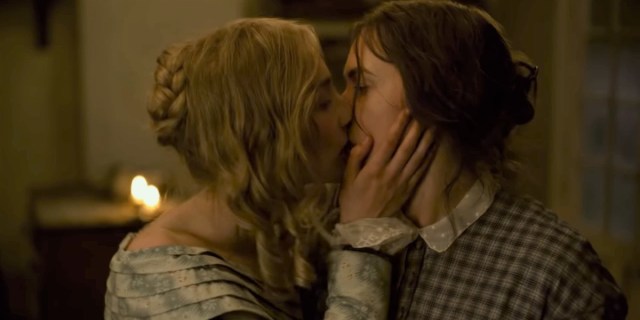 Kate Winslet and Saoirse Ronan kiss in Ammonite.