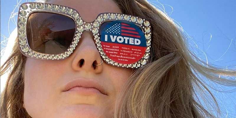 Caroline Rose Giuliani has on blinged out sunglasses, one of the lenses is covered with an "I Voted" sticker.