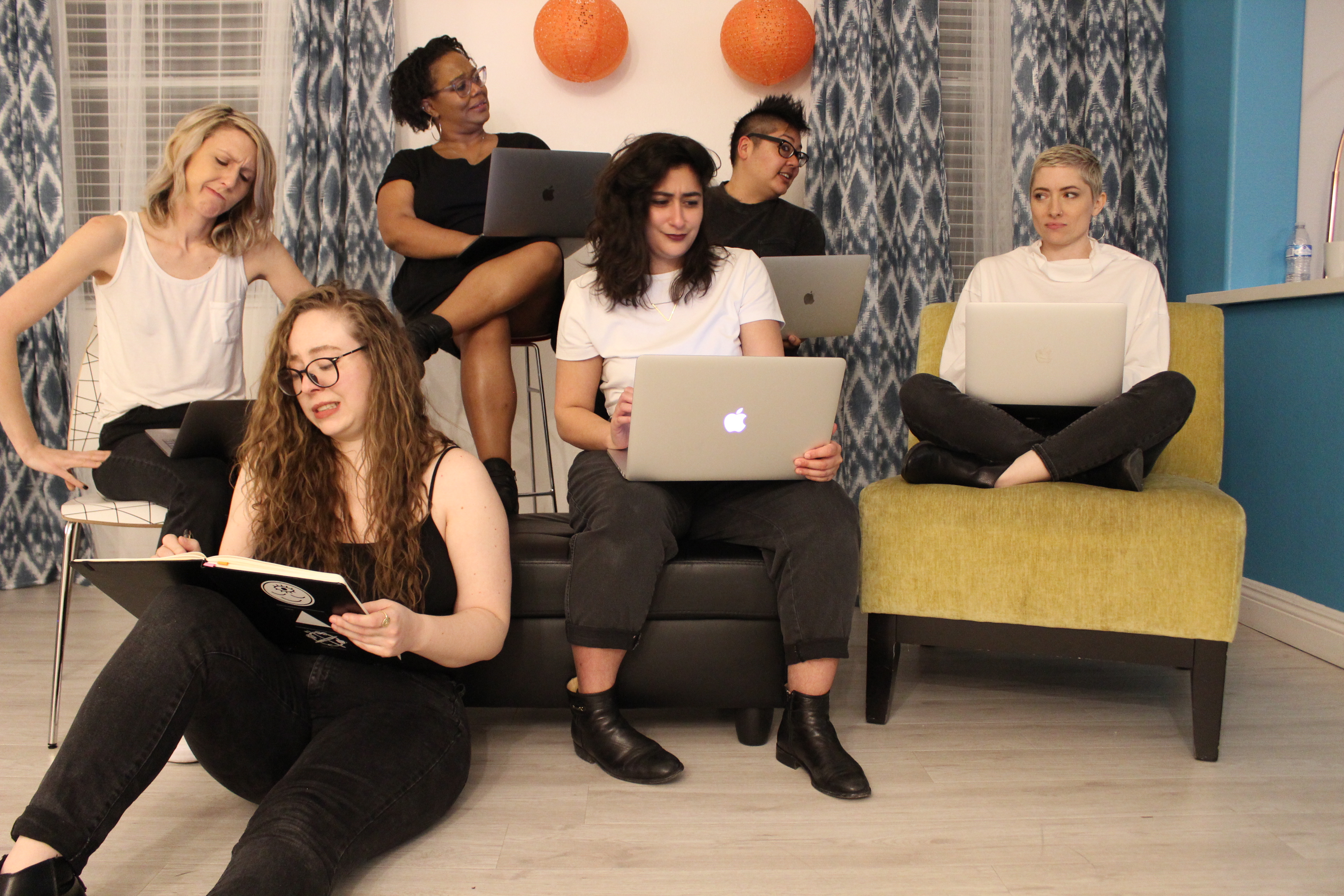 the team: riese, rachel, sarah, carmen, kamala, and laneia look concerned while staring at their computers