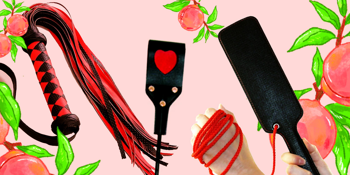 A collage of a red-and-black flogger, a black crop featuring a red heart, and a black faux leather paddle against a pink background surrounded by illustrated peaches