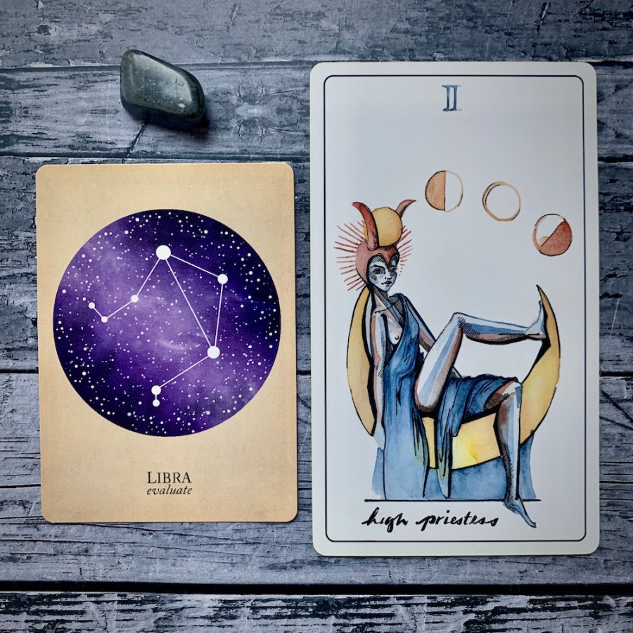 the Libra card from the Constellations deck and the High Priestess card