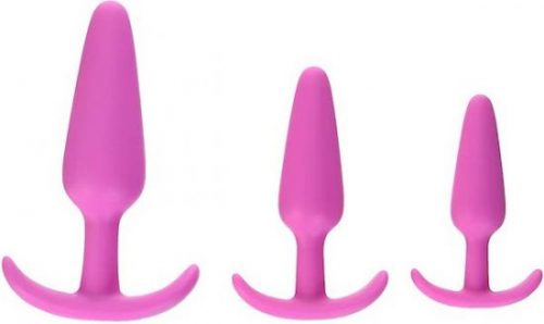 three slim pink butt plugs arranged from large to small