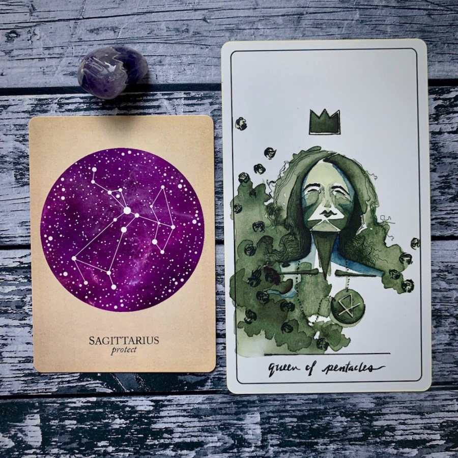 the Sagittarius card from the Constellations deck and the Queen of Pentacles card