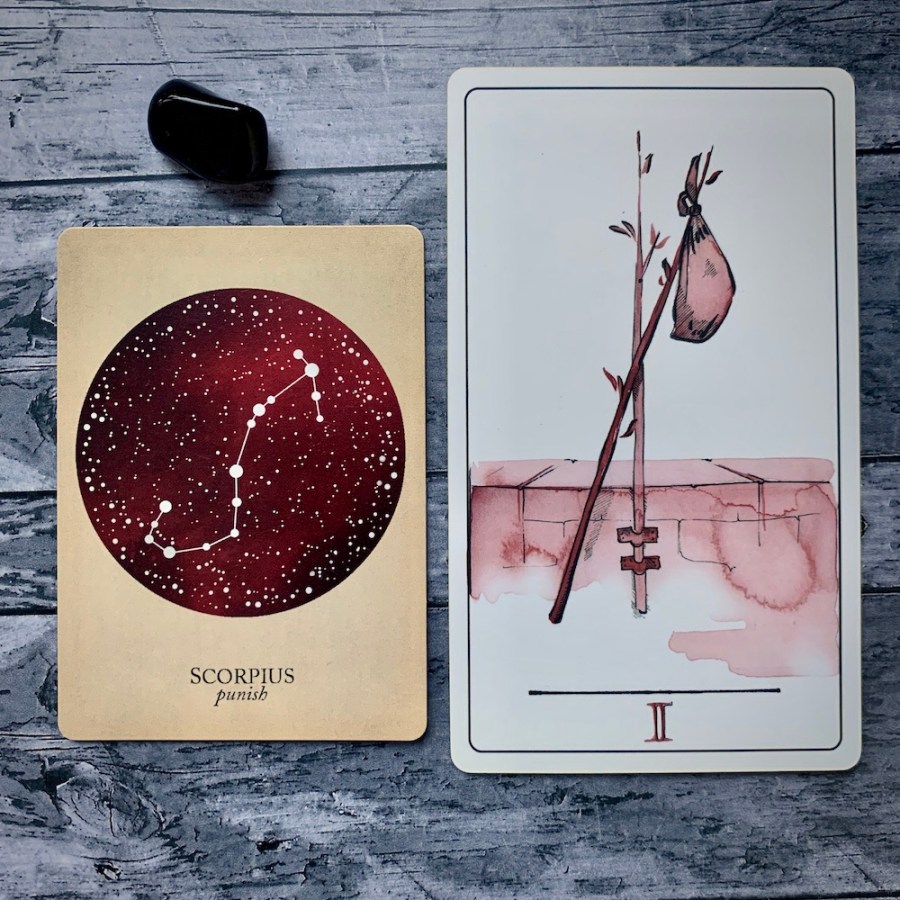 the Scorpio card from the Constellations deck and the Two of Wands card