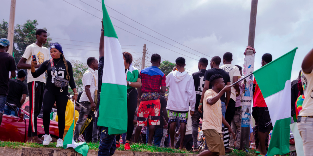 LAGOS, NIGERIA - OCTOBER 19, 2020: group of nigerian youths protesting around the city about end sars, end bad government, end police brutality in Nigeria.