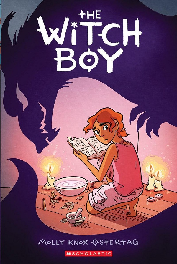 The cover of WITCH BOY features an illustrated figure of a thin young person with orange curly hair crouched over a spellbook, bowl and candles while a shadowy menacing dragon figure looms over them from behind.