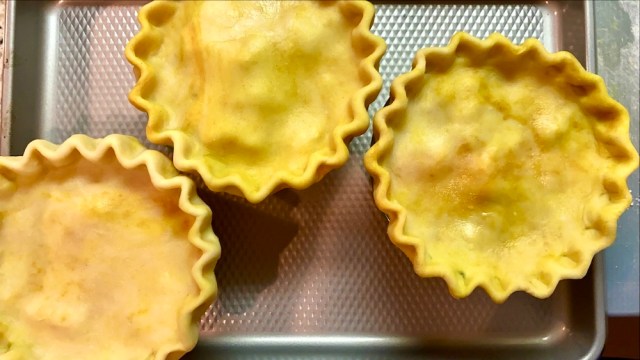 three chicken korma pot pies on a baking sheet