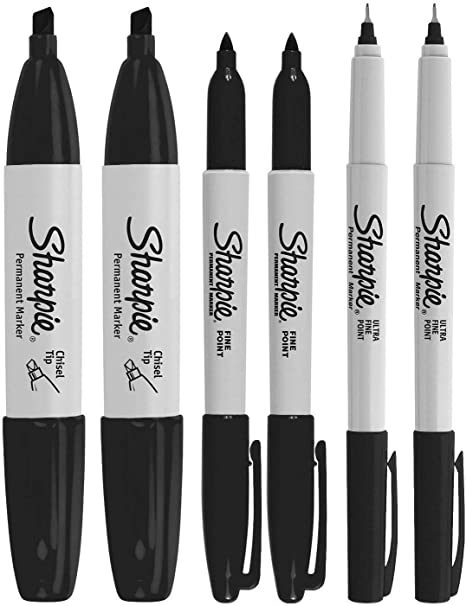 A row of black Sharpie markers of different sizes