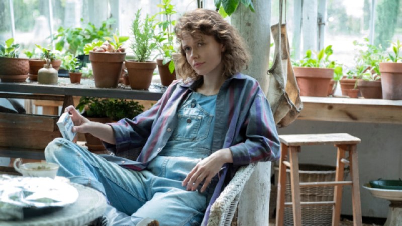 Jamie from Bly Manor is in denim overalls