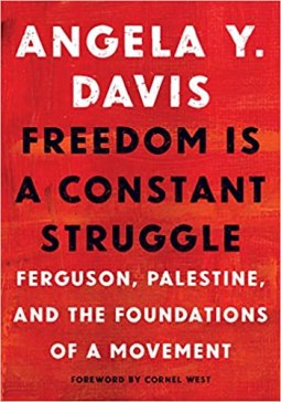 A book cover with a red background and white and black text that reads: Angela Y. Davis Freedom Is A Constant Struggle: Ferguson, Palestine, and the foundations of a movement