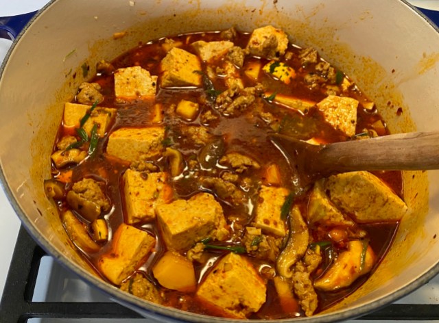 mapo tofu simmering on the stove 