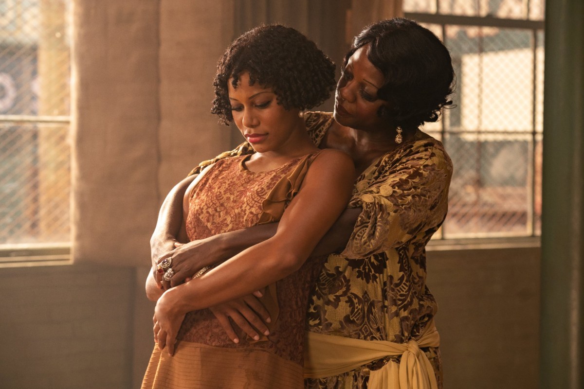 Viola Davis as Ma Rainey holding a woman in her arms.