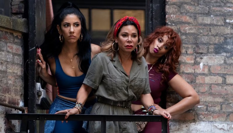 Stephanie Beatriz, Daphne Rubin-Vega, and Dascha Polanco stand on a balcony.