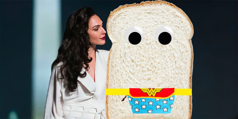 A Photoshopped image of Wonder Woman staring adoringly at a piece of white bread with googly eyes wearing a Wonder Woman fanny pack.